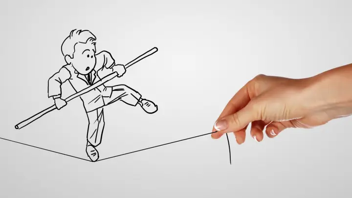A man on a type-rope symbolizing the challenges of running a business.
